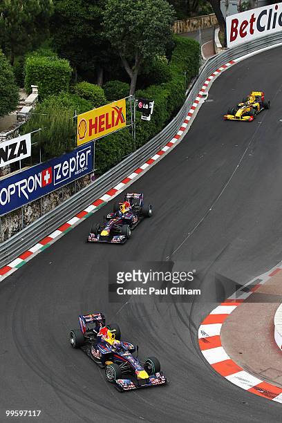 Mark Webber of Australia and Red Bull Racing leads from Sebastian Vettel of Germany and Red Bull Racing and Robert Kubica of Poland and Renault as he...