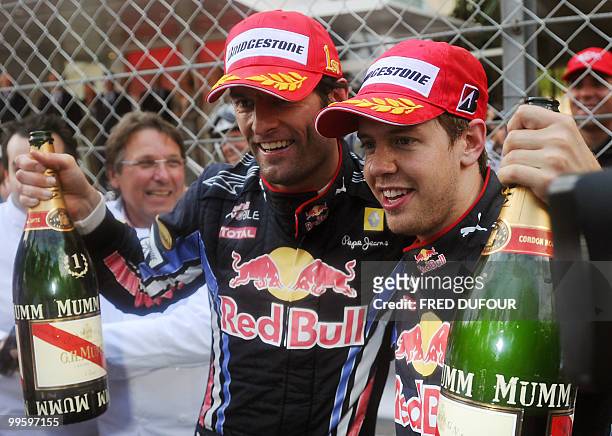 Red Bull's Australian driver Mark Webber celebrates with Red Bull's German driver Sebastian Vettel at the Monaco street circuit on May 16 after the...
