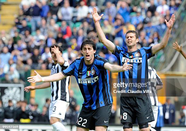 Diego Milito and Thiago Motta of FC Internazionale Milano react during the Serie A match between AC Siena and FC Internazionale Milano at Stadio...