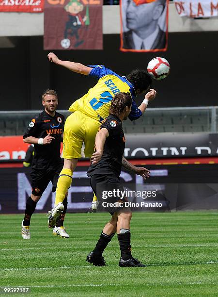 Francesco Totti of Roma competes with Francesco Scardina of Chievo during the Serie A match between AC Chievo Verona and AS Roma at Stadio...