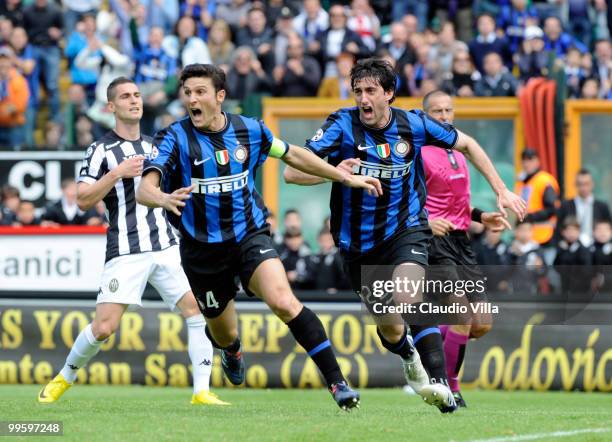 Diego Milito and Javier Zanetti of FC Internazionale Milano celebrate after the first goal during the Serie A match between AC Siena and FC...