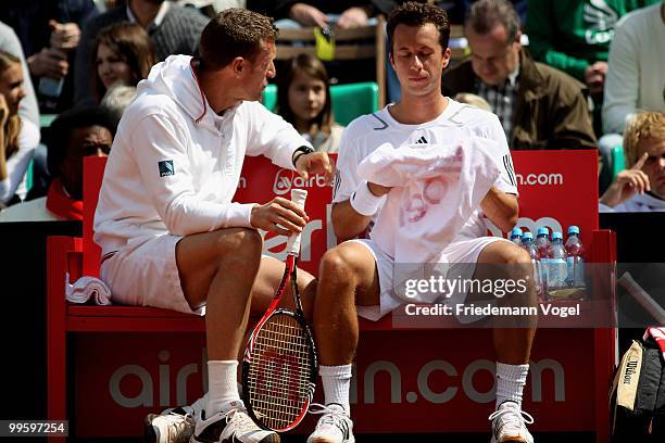 National coach Patrick Kuehnen and Philipp Kohlschreiber of Germany look on during day one of the ARAG World Team Cup at the Rochusclub on May 16,...