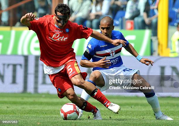 Fernando Tissone of UC Sampdoria battles for the ball against Michele Pazienza of SSC Napoli during the Serie A match between UC Sampdoria and SSC...