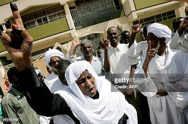 Wissal Mahdi Turabi , wife of arrested Islamist opposition leader Hassan al-Turabi, joins her husband's supporters as they shout slogans against his...