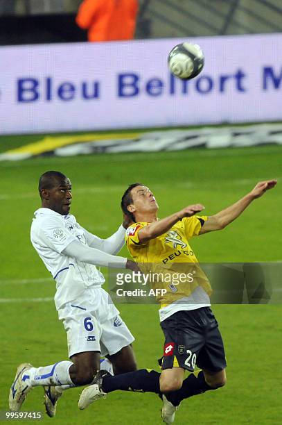 Auxerre's Malian defender Adama Coulibaly vies with FC Sochaux' forward Edouard Butin during the French L1 football match Sochaux vs. Auxerre on May...
