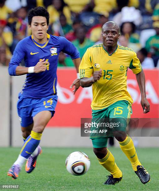 Lucas Thwala of South Africa fights for the ball with Winothai Teeratep of Thailand during their international friendly football match at the...