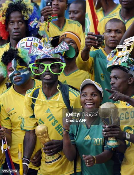Supporters of South African national football team cheer on May 16, 2010 at the Mbombela Stadium in Nelspruit during the international friendly...