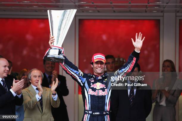 Mark Webber of Australia and Red Bull Racing celebrates with the trophy after winning the Monaco Formula One Grand Prix at the Monte Carlo Circuit on...