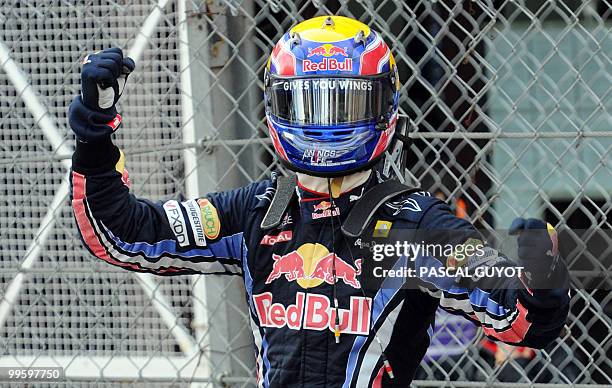 Red Bull's Australian driver Mark Webber celebrates at the Monaco street circuit on May 16 after the Monaco Formula One Grand Prix. Red Bull's...