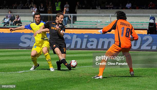 Gennaro Sardo of Chievo competes with Francesco Totti of Roma during the Serie A match between AC Chievo Verona and AS Roma at Stadio Marc'Antonio...