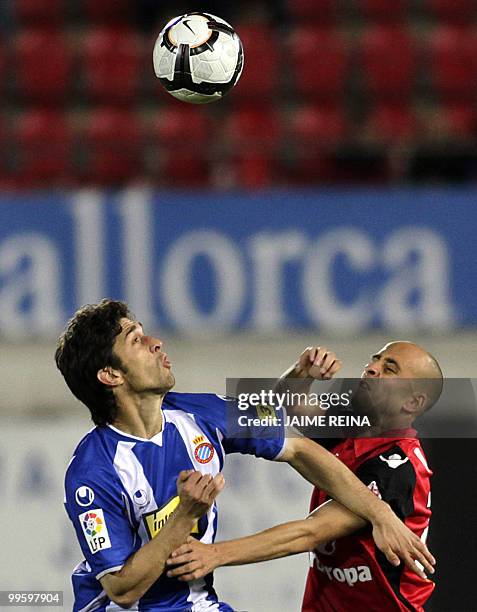 Espanyol's Argentinian defender Juan Forlín vies with Mallorca's midfielder Borja Valero during their Spanish League football match at the Ono...