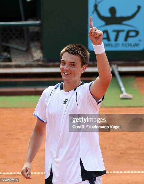 Andreas Beck of Germany celebrates after winning his match against Paul-Henri Mathieu of France during day one of the ARAG World Team Cup at the...