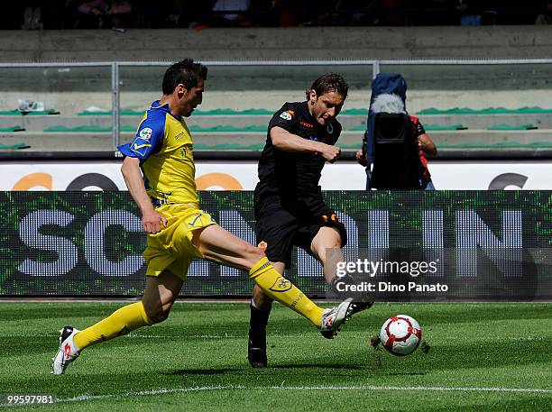 Gennaro Sardo of Chievo competes with Francesco Totti of Roma during the Serie A match between AC Chievo Verona and AS Roma at Stadio Marc'Antonio...