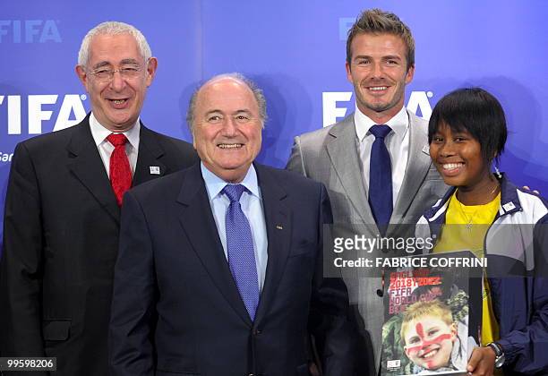 England 2018 World Cup bid chairman Lord Triesman stands beside FIFA president Sepp Blatter , former England football captain David Beckham coaching...