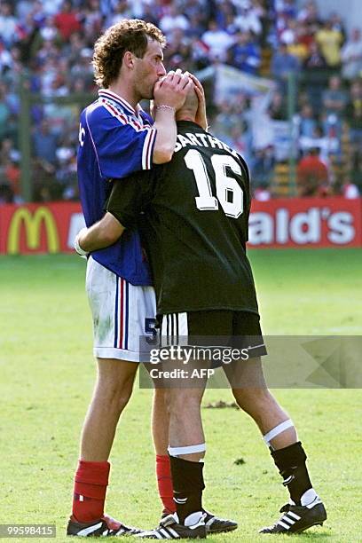 French defender Laurent Blanc kisses French goalkeeper Fabien Barthez after scoring the first golden goal in World Cup history 28 June at the Felix...
