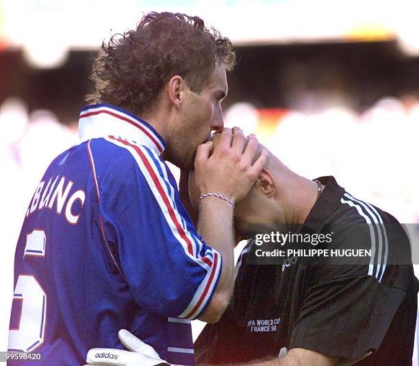 French defender Laurent Blanc kisses French goalkeeper Fabien Barthez after scoring the first golden goal in World Cup history to give France a 1-0...