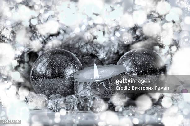 vintage new year. black and white photos, new year or christmas still life with candles - black christmas stockfoto's en -beelden