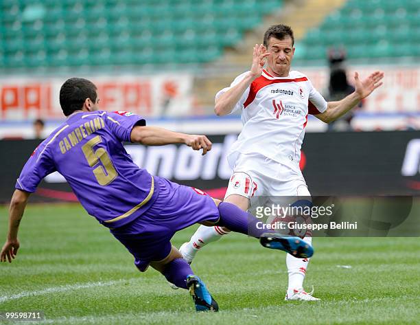 Alessandro Gamberini of Fiorentina and Salvatore Masiello of Bari in action during the Serie A match between AS Bari and ACF Fiorentina at Stadio San...