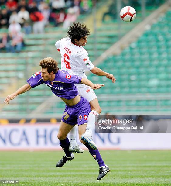Mario Bolatti of Fiorentina and Nacho of Bari in action during the Serie A match between AS Bari and ACF Fiorentina at Stadio San Nicola on May 16,...