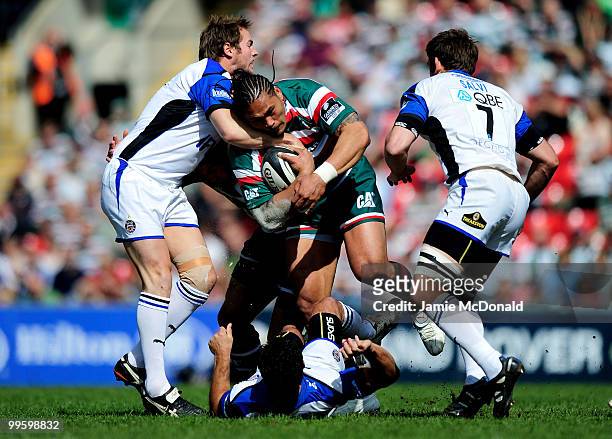 Alesana Tuilagi of Leicester Tigers is tackled by Butch James of Bath during the Guinness Premiership Semi Final match between Leicester Tigers and...