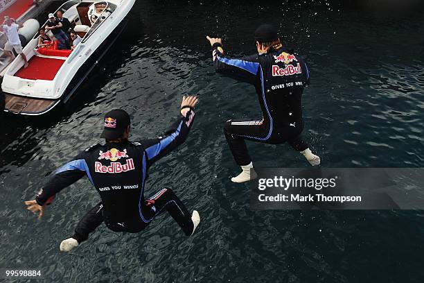 Race winner Mark Webber of Australia and Red Bull Racing celebrates with second placed team mate Sebastian Vettel of Germany and Red Bull Racing by...