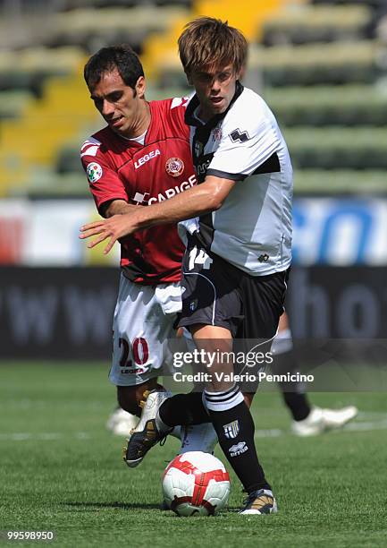 Daniele Galloppa of Parma FC battles for the ball with Claudio Bellucci of AS Livorno Calcio during the Serie A match between Parma FC and AS Livorno...