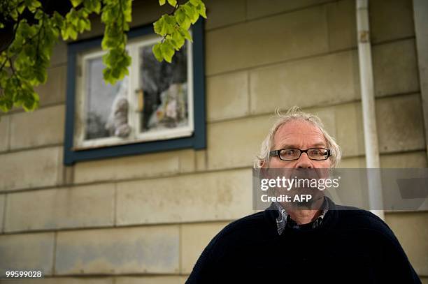 Swedish cartoonist Lars Vilks stands beside the broken kitchen window on his home outside Hoganas on May 16, 2010.The house of Swedish cartoonist...