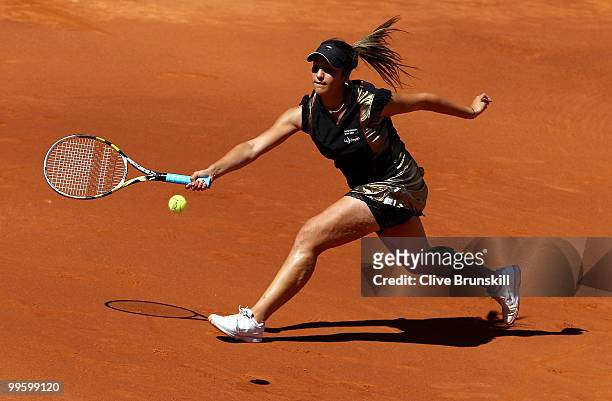 Aravane Rezai of France plays a forehand against Venus Williams of the USA in the womens final match during the Mutua Madrilena Madrid Open tennis...