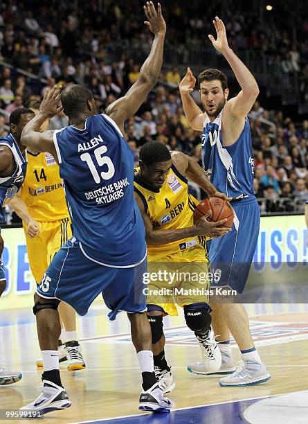 Derrick Byars of Berlin is attacked by Derrick Allen of Frankfurt and team mate Dragan Labovic during the Beko Basketball Bundesliga Play-Off match...