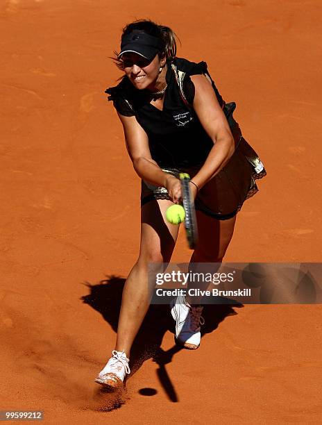 Aravane Rezai of France plays a backhand against Venus Williams of the USA in the womens final match during the Mutua Madrilena Madrid Open tennis...