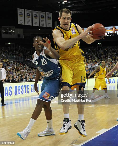 Adam Chubb of Berlin fights for the ball with Jimmy McKinney of Frankfurt during the Beko Basketball Bundesliga Play-Off match between Alba Berlin...