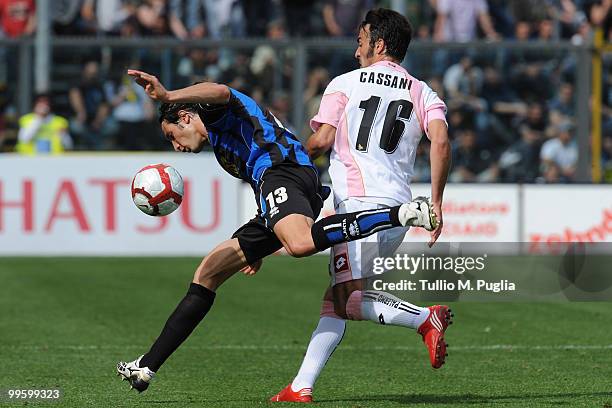 Federico Peluso of Atalanta and Mattia Cassani of Palermo compete for the ball during the Serie A match between Atalanta BC and US Citta di Palermo...