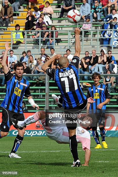 Paolo Bianchi of Atalanta puts his hand toward the ball as he battles with Giovanni Tedesco of Palermo during the Serie A match between Atalanta BC...