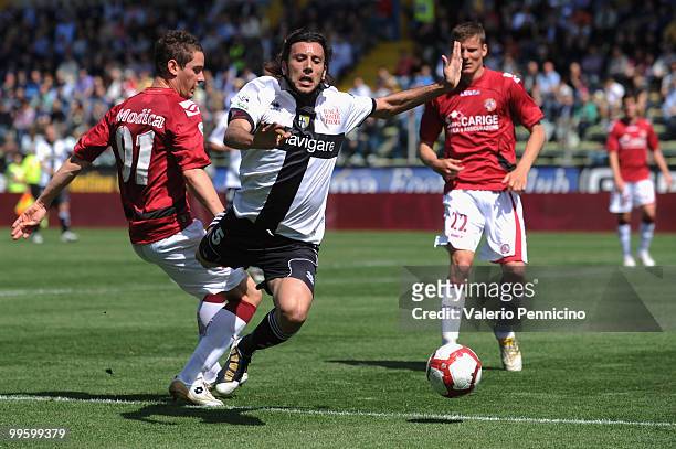 Christian Zaccardo of Parma FC is challenged by Samuele Modica of AS Livorno Calcio during the Serie A match between Parma FC and AS Livorno Calcio...