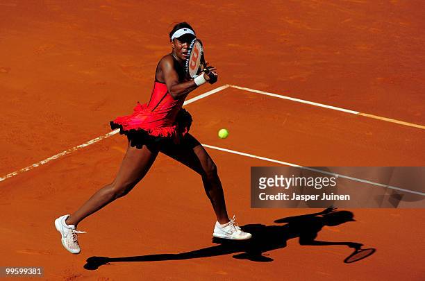 Venus Williams of the USA plays a backhand to Aravane Rezai of France in their final match during the Mutua Madrilena Madrid Open tennis tournament...
