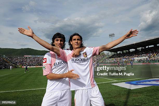 Edinson Cavani of Palermo celebrates with his team mate Javier Pastore after scoring a penalty during the Serie A match between Atalanta BC and US...