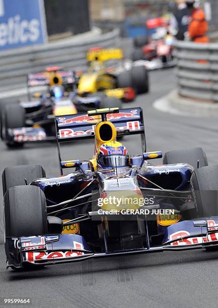 Red Bull's Australian driver Mark Webber drives ahead of Red Bull's German driver Sebastian Vettel and Renault f1's Polish driver Robert Kubica at...