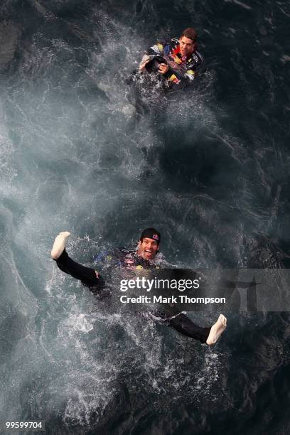 Race winner Mark Webber of Australia and Red Bull Racing celebrates with second placed team mate Sebastian Vettel of Germany and Red Bull Racing by...