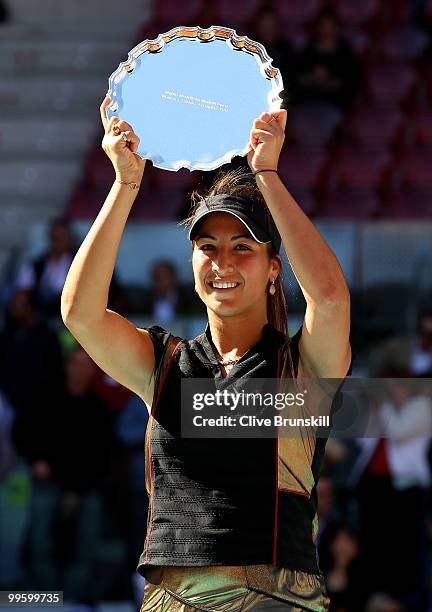 Aravane Rezai of France holds aloft the winners torphy after her straight sets victory against Venus Williams of the USA in the womens final match...