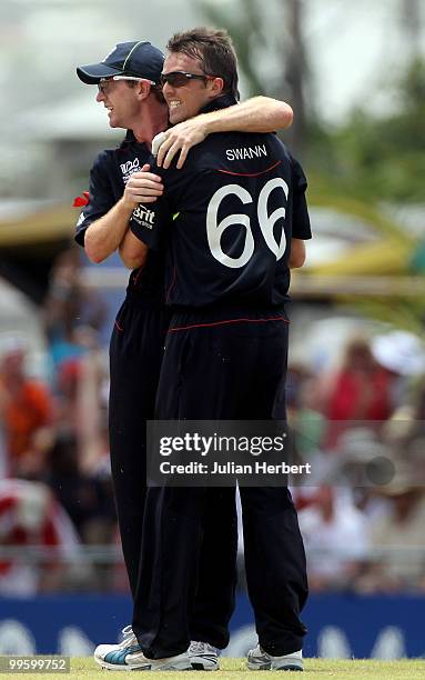 Paul Collingwood and Graeme Swann of England celebrate the wicket of Michael Clarke during the final of the ICC World Twenty20 between Australia and...