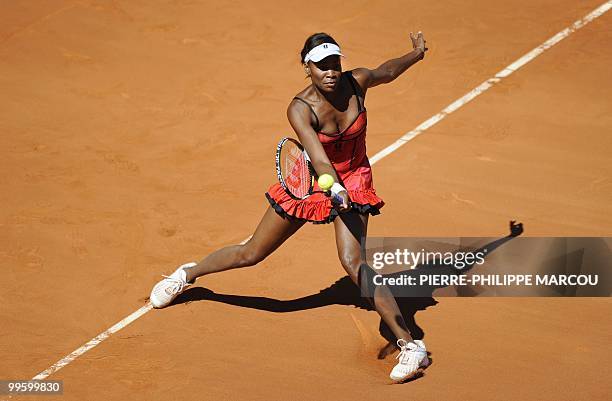 Venus Williams returns a ball to French Aravane Rezai during their final match of the Madrid Masters on May 16, 2010 at the Caja Magic sports complex...