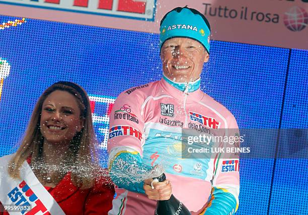 Kazakhstan's Alexandre Vinokourov of team Astana celebrates on the podium wearing his pink jersey during the 8th stage of the 93rd Giro d'Italia, in...