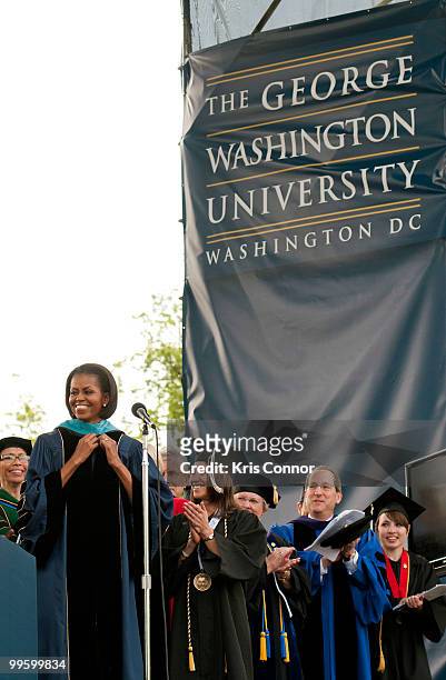 Michelle Obama recieves a honorary doctorate in Public Service during the 2010 George Washington University commencement at the National Mall on May...