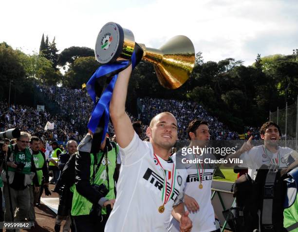 Wesley Sneijder of FC Internazionale Milano celebrates with the League trophy after the Serie A match between AC Siena and FC Internazionale Milano...