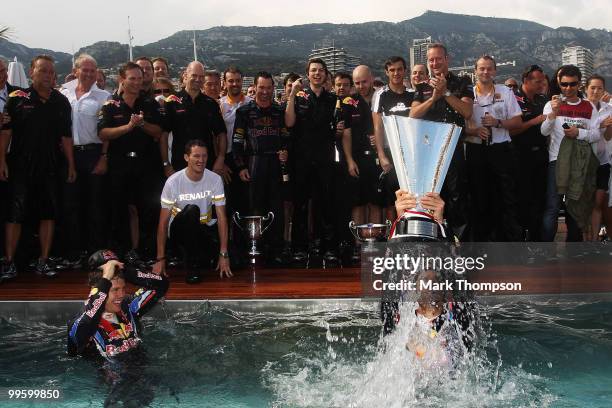 Race winner Mark Webber of Australia and Red Bull Racing celebrates with second placed Sebastian Vettel of Germany and Red Bull Racing in the Red...