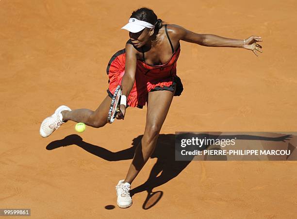 Venus Williams returns a ball to French Aravane Rezai during their final match of the Madrid Masters on May 16, 2010 at the Caja Magic sports complex...