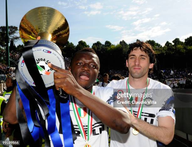Sulley Muntari and Diego Alberto Milito of FC Internazionale Milano celebrate with the league trophy after the Serie A match between AC Siena and FC...