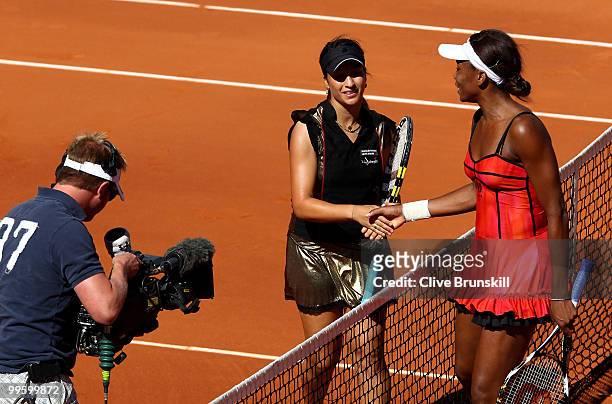 Aravane Rezai of France shakes hands at the net after her straight sets victory against Venus Williams of the USA in the womens final match during...