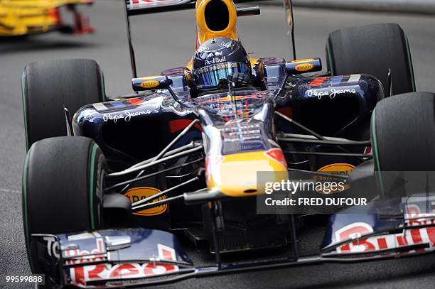 Red Bull's German driver Sebastian Vettel drives at the Monaco street circuit on May 16 during the Monaco Formula One Grand Prix. AFP PHOTO / FRED...