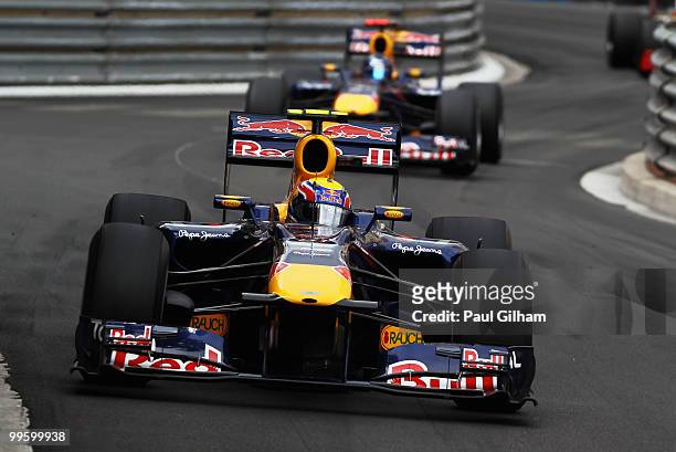 Mark Webber of Australia and Red Bull Racing leads from team mate Sebastian Vettel of Germany and Red Bull Racing on his way to winning the Monaco...